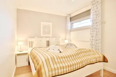 Ein Bett oder Betten in einem Zimmer der Unterkunft Appartement am neuen Kurpark Seaside Appartement 4