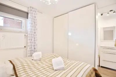 Ein Bett oder Betten in einem Zimmer der Unterkunft Appartement am neuen Kurpark Seaside Appartement 4