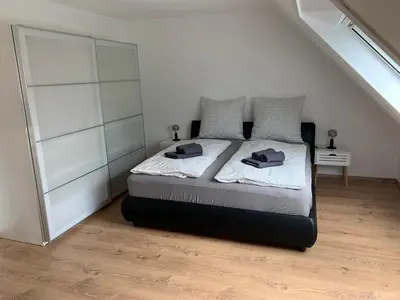 Ein Bett oder Betten in einem Zimmer der Unterkunft MeerZeit-Scharbeutz