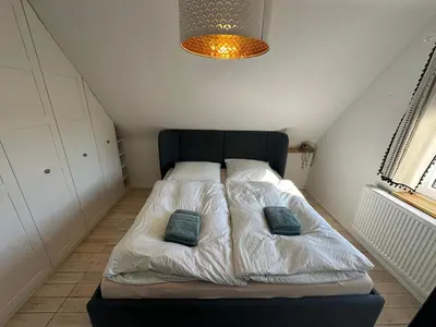 Ein Bett oder Betten in einem Zimmer der Unterkunft Haus Königsee 