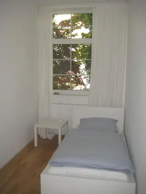 Ein Bett oder Betten in einem Zimmer der Unterkunft Ferienwohnung Lübeck Falkenwiese