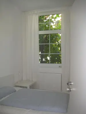 Ein Bett oder Betten in einem Zimmer der Unterkunft Ferienwohnung Lübeck Falkenwiese