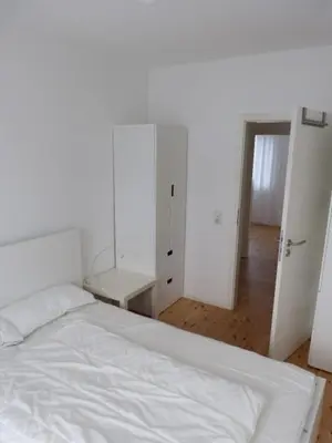 Ein Bett oder Betten in einem Zimmer der Unterkunft Ferienhaus Lübeck Falkenwiese