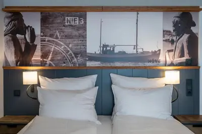 Ein Bett oder Betten in einem Zimmer der Unterkunft 4Hafenzeiten - NIE3 Möve