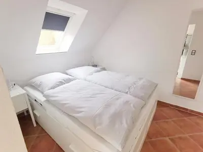 Ein Bett oder Betten in einem Zimmer der Unterkunft Obj 87 Familiy Ferienhaus für 2-6 Personen 100 m zum Strand, Garten