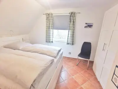 Ein Bett oder Betten in einem Zimmer der Unterkunft Obj 87 Familiy Ferienhaus für 2-6 Personen 100 m zum Strand, Garten