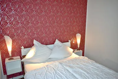 Ein Bett oder Betten in einem Zimmer der Unterkunft Am Rosenhain 14 Ferienwohnung Nr 01