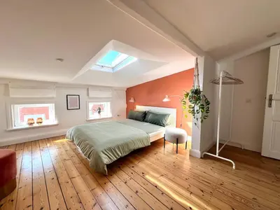 Ein Bett oder Betten in einem Zimmer der Unterkunft Boutique Apartment im charmanten Altbau
