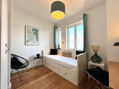 Ein Bett oder Betten in einem Zimmer der Unterkunft Boutique Apartment im charmanten Altbau