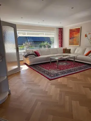 Ein Sitzbereich in der Unterkunft Dünenhaus Garten 2 Schlafzimmer