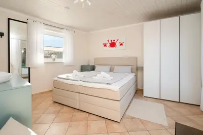 Ein Bett oder Betten in einem Zimmer der Unterkunft Ferienwohnung 