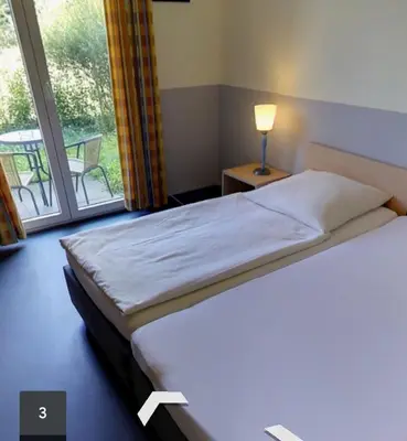 Ein Bett oder Betten in einem Zimmer der Unterkunft Frisco