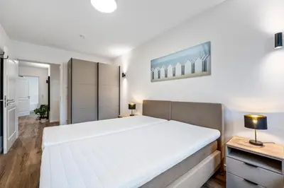 Ein Bett oder Betten in einem Zimmer der Unterkunft Ferienwohnung Strandkorb Rosenhagen bei Travemünde