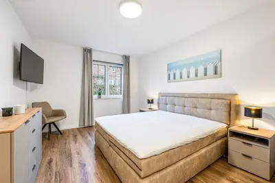 Ein Bett oder Betten in einem Zimmer der Unterkunft Ferienwohnung Strandkorb Rosenhagen bei Travemünde