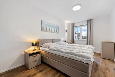 Ein Bett oder Betten in einem Zimmer der Unterkunft Ferienwohnung Strandhafer Rosenhagen bei Travemünde