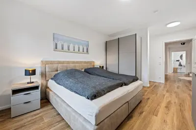 Ein Bett oder Betten in einem Zimmer der Unterkunft Ferienwohnung Strandhafer Rosenhagen bei Travemünde