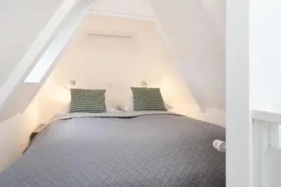 Ein Bett oder Betten in einem Zimmer der Unterkunft Lüttge Hus
