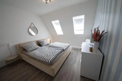 Ein Bett oder Betten in einem Zimmer der Unterkunft Hyggehuus