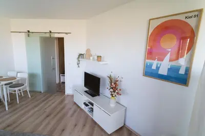 TV/Unterhaltungsangebot in der Unterkunft Erholung im Trave Kieker 004 mit Pool und Sauna