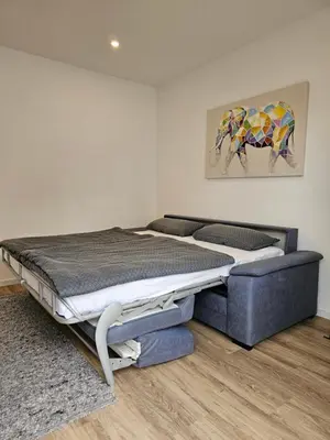Ein Bett oder Betten in einem Zimmer der Unterkunft FeWo Safari - zwischen Holstentor & Ostsee