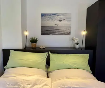 Ein Bett oder Betten in einem Zimmer der Unterkunft FeWo am See