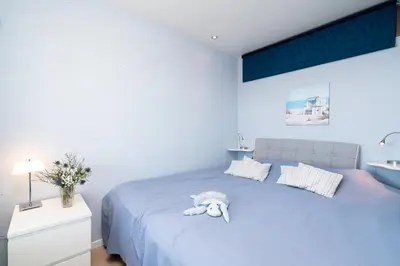 Ein Bett oder Betten in einem Zimmer der Unterkunft Panoramic Sierksdorf Ostsee Fernblick 12