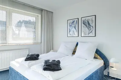 Ein Bett oder Betten in einem Zimmer der Unterkunft Meerliebe