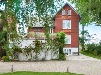 Ein Garten an der Unterkunft Villa Dünenblick Apartment Seepferdchen