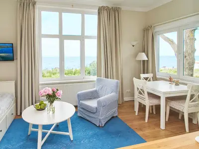Ein Sitzbereich in der Unterkunft Villa Dünenblick Apartment Strandkieker
