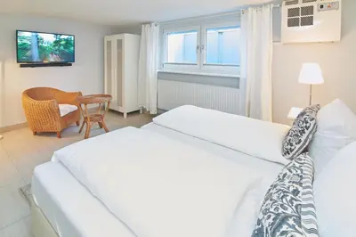 Ein Bett oder Betten in einem Zimmer der Unterkunft Villa Dünenblick Beachhouse Apartment Sunrise