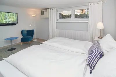 Ein Bett oder Betten in einem Zimmer der Unterkunft Villa Dünenblick Beachhouse Apartment Sunrise