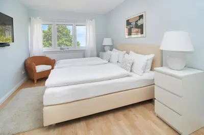 Ein Bett oder Betten in einem Zimmer der Unterkunft Villa Dünenblick Beachhouse Apartment Sunrise