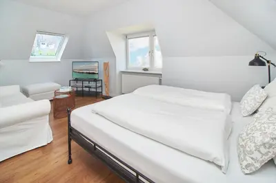 Ein Bett oder Betten in einem Zimmer der Unterkunft Villa Dünenblick Beachhouse Apartment Sunset