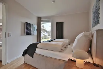 Ein Bett oder Betten in einem Zimmer der Unterkunft Residenz Wohnen am Meer Wohnen am Meer Appartement 07