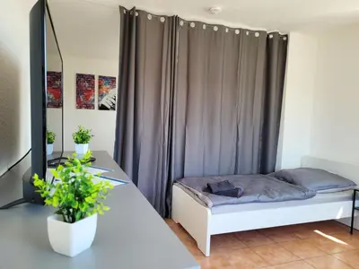Ein Bett oder Betten in einem Zimmer der Unterkunft Work & Relax Apartment in Industrial area