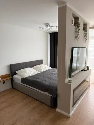 Ein Bett oder Betten in einem Zimmer der Unterkunft FeWo am Hansa Park