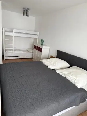 Ein Bett oder Betten in einem Zimmer der Unterkunft FeWo am Hansa Park