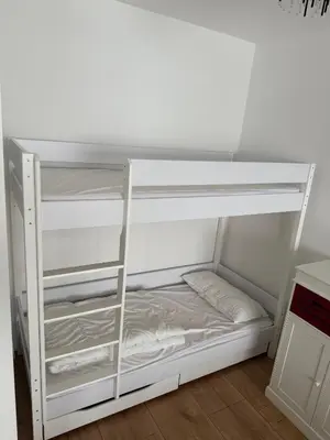 Ein Bett oder Betten in einem Zimmer der Unterkunft FeWo am Hansa Park