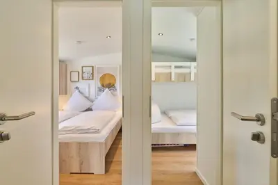 Ein Bett oder Betten in einem Zimmer der Unterkunft Ostseecamp Ferienhaus 