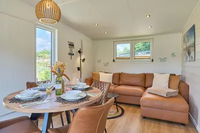 Ein Sitzbereich in der Unterkunft Ostseecamp Ferienhaus 