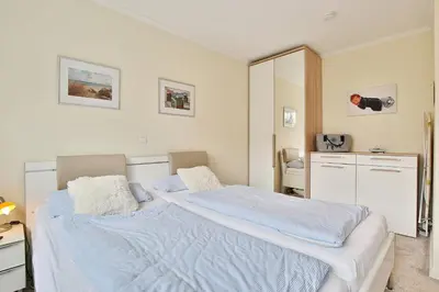 Ein Bett oder Betten in einem Zimmer der Unterkunft Residenz am Kurpark Appartement 3