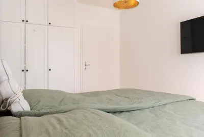 Ein Bett oder Betten in einem Zimmer der Unterkunft Ferienwohnung Ostseekoje - Haffkrug