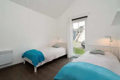 Ein Bett oder Betten in einem Zimmer der Unterkunft Strandpark Sierksdorf H051