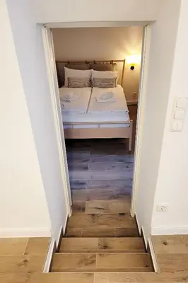 Ein Bett oder Betten in einem Zimmer der Unterkunft Moderne Lounge-Ferienwohnung mit Terrasse, Strandkorb, Parkplatz - 50 Meter zum Strand
