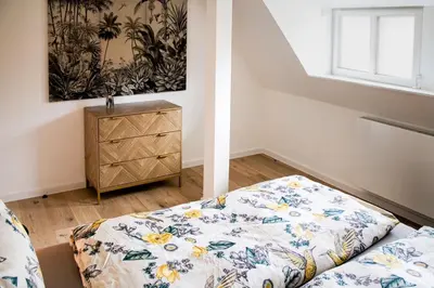 Ein Bett oder Betten in einem Zimmer der Unterkunft De lütte Koje