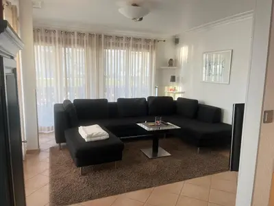 Ein Sitzbereich in der Unterkunft Strandnahe Ferienwohnung