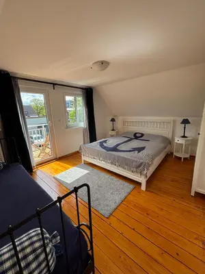 Ein Bett oder Betten in einem Zimmer der Unterkunft Hafenhäuschen
