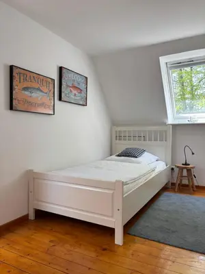 Ein Bett oder Betten in einem Zimmer der Unterkunft Hafenhäuschen