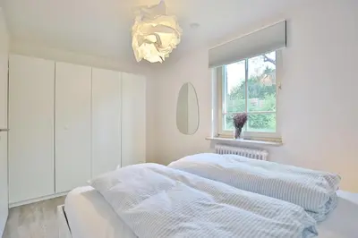 Ein Bett oder Betten in einem Zimmer der Unterkunft Ferienanlage Bergstraße 62 Ferienhaus Bergstraße 62 Appartement 5 Tide am Park