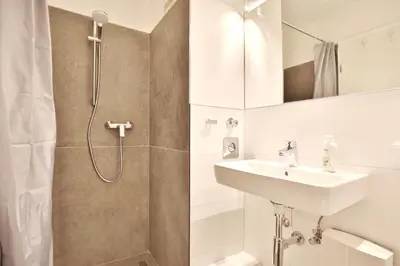 Ein Badezimmer in der Unterkunft Ferienanlage Bergstraße 62 Ferienhaus Bergstraße 62 Appartement 5 Tide am Park